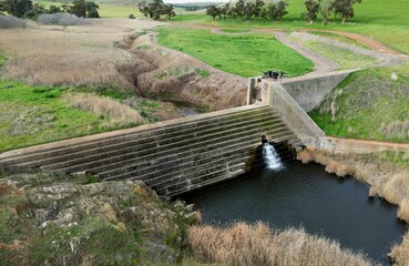 Sticker - Aerial view of a dam in a vast countryside on a sunny day