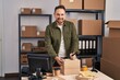 © Krakenimages.com - Young caucasian man ecommerce business worker writing on package at office
