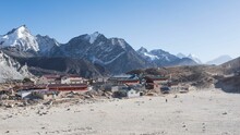 An Old Mountain Village Is In The Middle Of A Barren Landscape