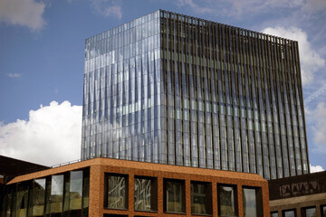 The building of a modern business center against the blue sky.