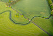 Aerial view of a river winding through the fields in the countryside in Kent, UK