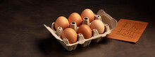 Cardboard Package Container Of Fresh Brown Eggs On Rustic Wooden Table As Wide Banner Design With Copyspace Area - Generative AI