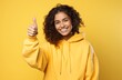 portrait of a happy young woman on a yellow background