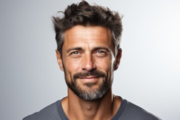 Closeup portrait of smiling man 30s having bristle looking at camera isolated over white background