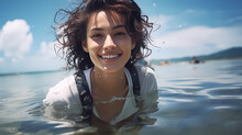  Young Woman Smiling Towards The Camera, With The Reflection Of Her Smile Seen In The Calm Beach Water