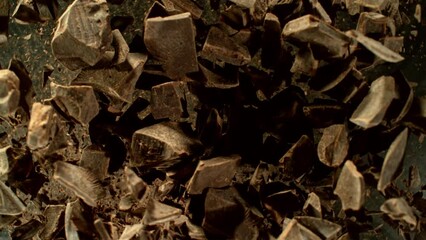 Poster - Super Slow Motion of Rotating Group of Raw Chocolate Pieces. Super Fast Camera Motion. Filmed on High Speed Cinema Camera, 1000fps, Placed on High Speed Cine Bot. 