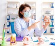 © Elnur - Female doctor working on new teeth implant