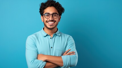 Sticker - portrait of a businessman with his arms crossed on a sky blue background