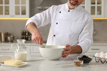 Wall Mural - Professional chef making dough at white marble table indoors, closeup