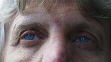 Senior Man Close-up Eyes Looking Up At Sky, One Caucasian Older Person With Blue Eyes Staring At Clouds With Pensive Thoughtful Emotion