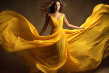Woman In Yellow Waving Dress With Flying Fabric.