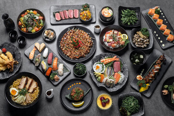 many traditional japanese food dishes variety on grey background