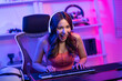 © Kawee - Asian beautiful Esport woman gamer play online video game on computer.