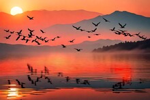 Beautiful Nature Landscape Birds Flock Flying In A Row Over Lake Water Red Sun On The Colorful Sky During Sunset Over The Mountains For Background