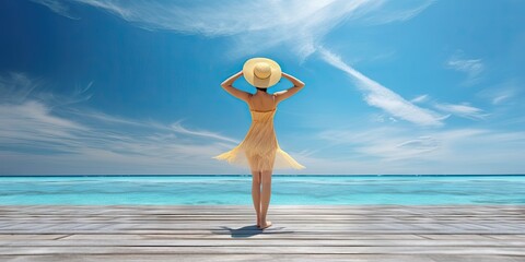 Wall Mural - Travel concept. Beautiful woman standing on beach and sea with copy space