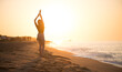 © Subbotina Anna - Beauty young happy woman raising hands, sea side. Girl's silhouette on a summer beach over sunrise. Beautiful woman enjoying nature in sunlight. Sunset. Healthy lifestyle, vacation, happiness concept