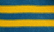 © svf74 - Handmade knitted fabric wool blue yellow stripes background texture.Selective focus.