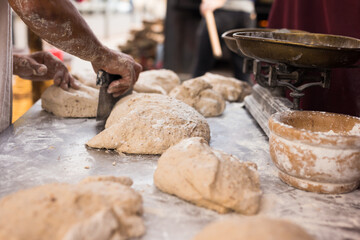 Wall Mural - Male hands knead yeast dough for baking bread