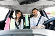 © Prostock-studio - Cheerful spouses driving home after shopping in mall, talking, smiling