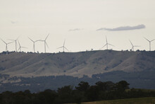 Aerial View Of Wind Turbines On The Hilltop In Melbourne Countryside, Victoria, Australia.