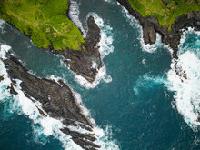 Aerial View Of Waves Crashing On The Rocks Along The Coastline At Kukui Bay, Maui County, Hawaii, United States.