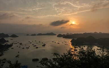 Sticker - a sunset view of a large body of water with boats and hills