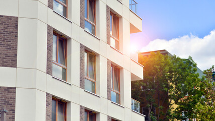 Wall Mural - Modern apartment buildings on a sunny day with a blue sky. Facade of a modern apartment building