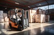 © sirisakboakaew - A large retail warehouse filled with shelves with goods stored on manual pallet trucks in cardboard boxes and packages. driving a forklift in the background Logistics and distribution facilities for