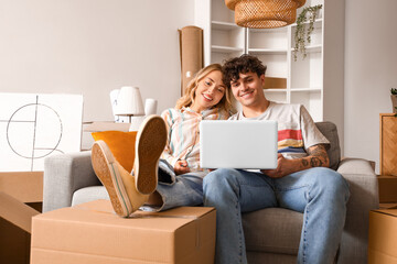 Sticker - Young couple using laptop in room on moving day