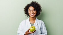 Pretty Nutritionist Holding An Apple