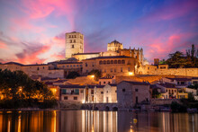 View At Dusk Of The Old Town Of Zamora, Castilla Y Len, Spain, With The Cathedral On Top And The Tormes River In The Foreground