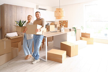 Poster - Mature couple with cardboard boxes in kitchen on moving day