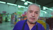 © Marco - Portrait of a worried elderly manager of supermarket struggling through hard times. Preoccupied stressed unshaven gray hair senior business owner