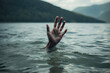 A hand emerging from a lake, reaching up as if trying to grab something