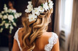 © MVProductions - Hairdresser making an elegant hairstyle styling bride with white flowers in her hair