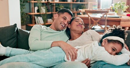 Poster - Family, hug and laughing on a sofa at home to relax, bond and quality time while playing together. A happy man, woman or parents and a girl child jump in a living room with happiness, love and care