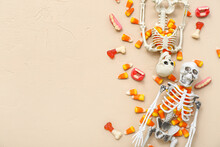 Tasty Halloween Candy Corns And Skeletons On Beige Background