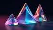 Three vibrant glass pyramids shining on a contrasting dark background