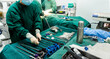 Surgeons are operating with nurse preparing medical instruments