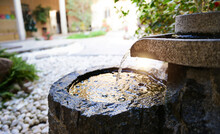 Traditional Spring Water Fountain In Garden