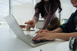 © itchaznong - Businesspeople working and typing on laptop keyboard on laptop computer at office.