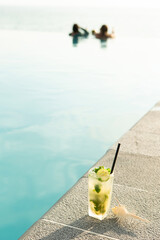 Poster - Resort swimming pool, a glass of cool limeade