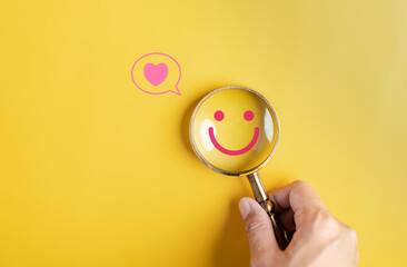 Wall Mural - Magnifier focus to happy smile face. mental health positive thinking and growth mindset, mental health care recovery to happiness emotion.