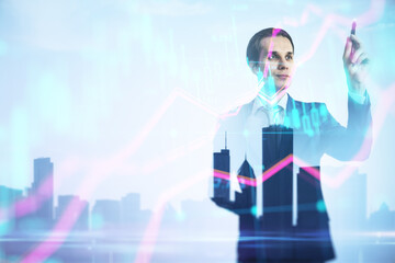 Wall Mural - Successful young business man silhouette using forex chart hologram on blurry city background with mock up city view. Future and financial freedom concept. Double exposure.