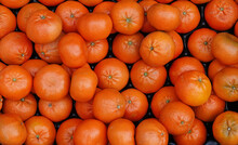 A Closeup Shot Of A Box Of Fresh Tangerines For Sale At A Market. 
