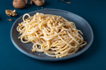 Wall Mural - Spaghetti with walnut cream. Simple, nutritious and tasty dish suitable for those who follow a vegetarian diet.