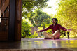 © Wavebreak Media - Focused indian man practicing yoga on sunny terrace, copy space