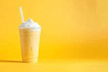Mango Smoothie Milkshake In Plastic Takeaway Cup Isolated On Yellow Background With Copy Space
