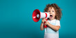Child Boy with long hair shouting through red Megaphone. Announcements Concept. Blue Background. 