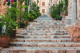 Fototapeta Na drzwi - View of a medieval street in the Old Town of the picturesque Spanish-style village Fornalutx, Majorca or Mallorca island